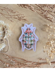 Poussière à aiguilles : Scarabée